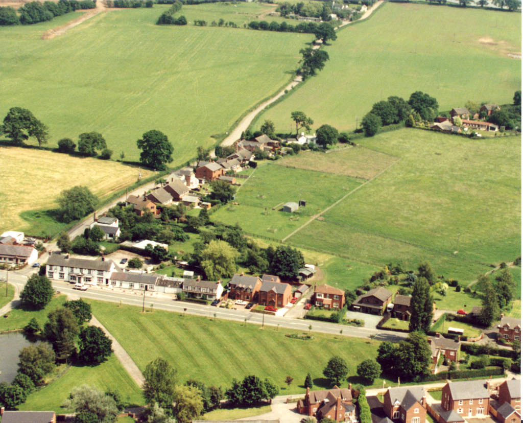 An aerial view of Hankelow village centre looking east around 1990