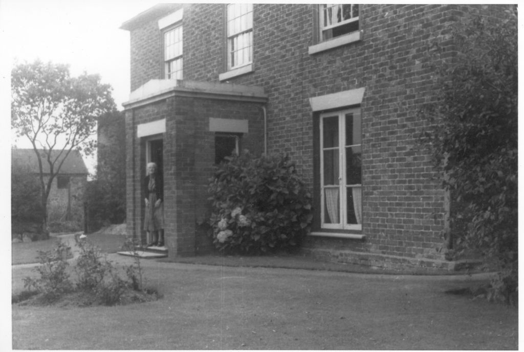 Mrs Cliffe in front of Hankelow House in the 1940s